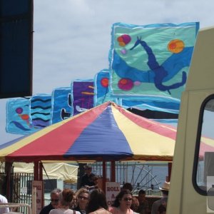 Flags on the Jubilee pool and Quay Fair stall