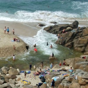 Portheras Cove - People bathe where the stream meets the sea.