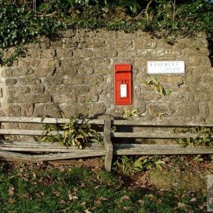 Letter Box near Church and a rickety public bench