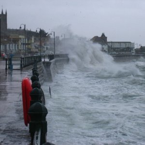 Large waves batter the prom