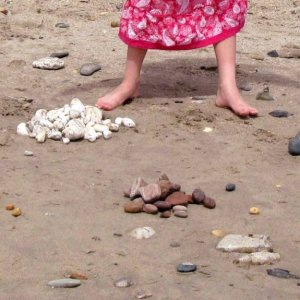 Creation of beach art at Long Rock