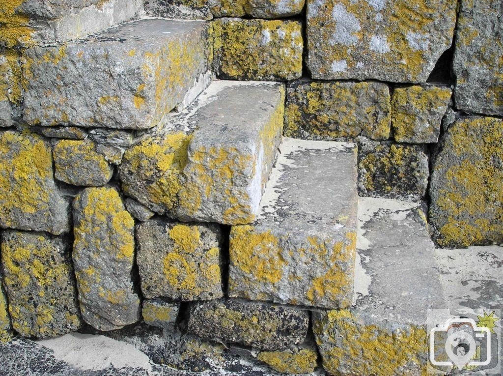 Ancient steps down from Mousehole's west harbour pier