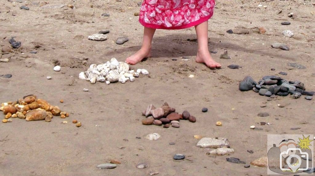 Creation of beach art at Long Rock