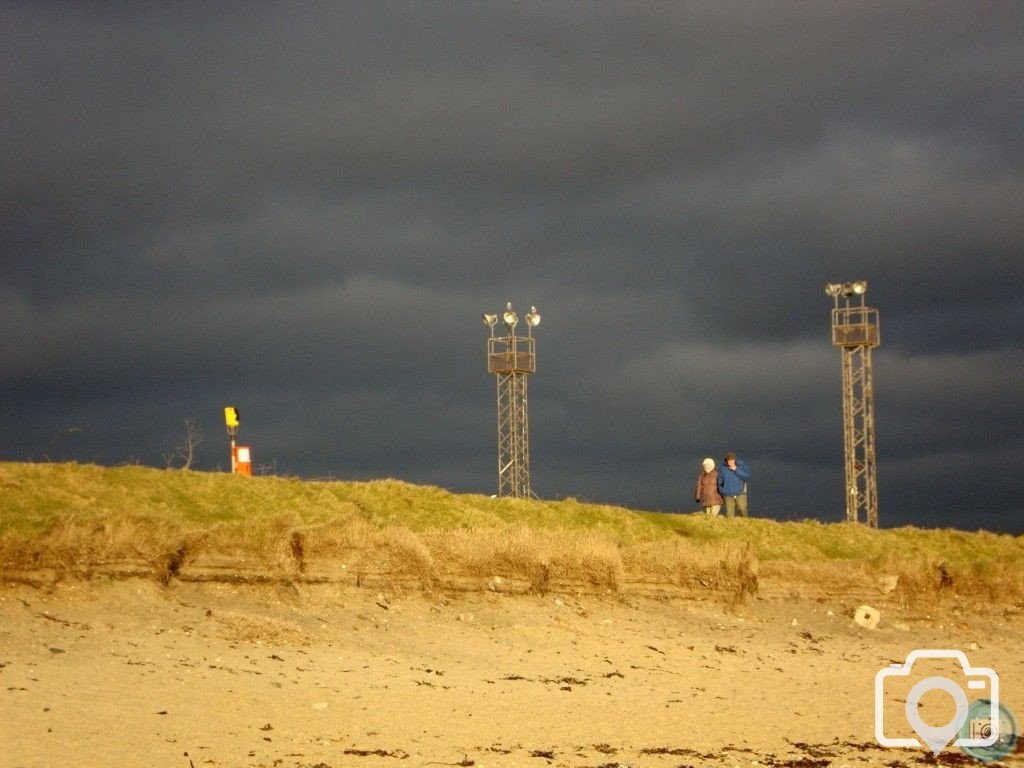 Dark skies over Long Rock beach