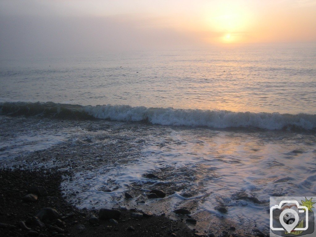 Misty ocean sunrise