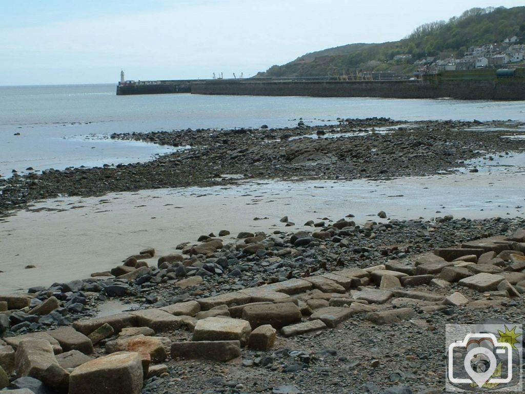 Remnants of the old sea wall at Tolcarne - South Pier in the distance