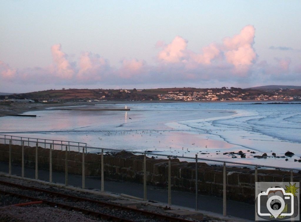 Sunset over Eastern Green and Long Rock to Marazion