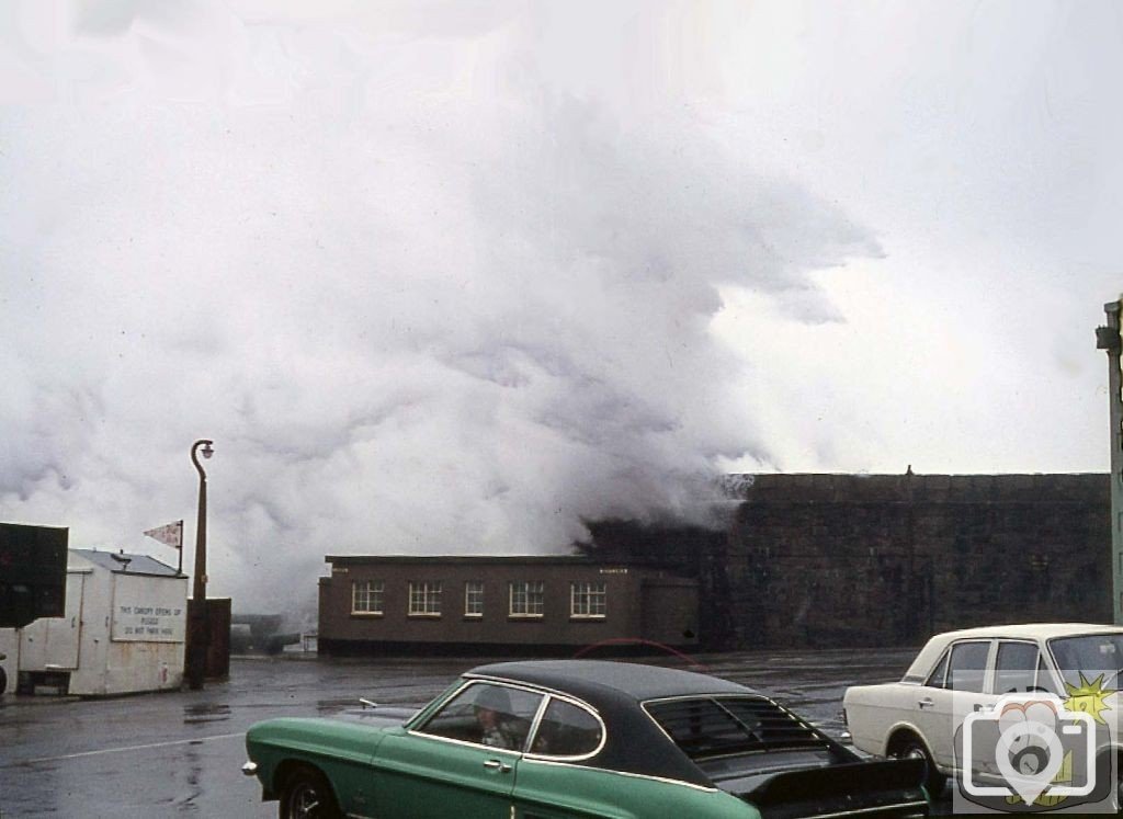 Towering spray over loo near the pier and docks- March, 1977